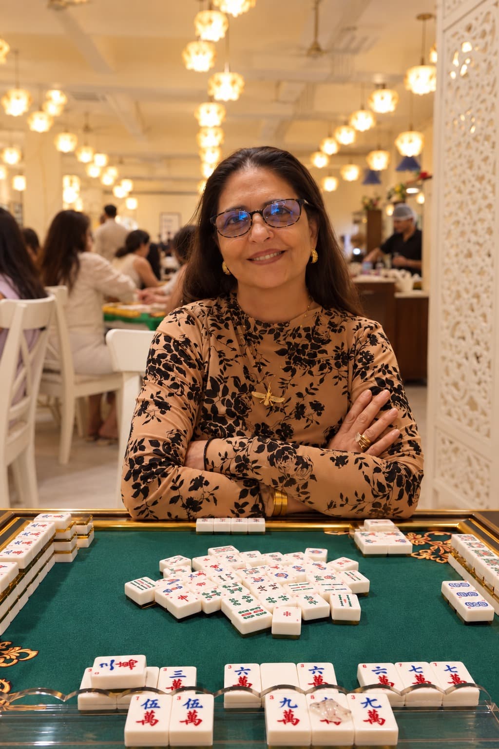 Phirooza Fia Rustumji at a Mahjong table in Fia's Lounge
